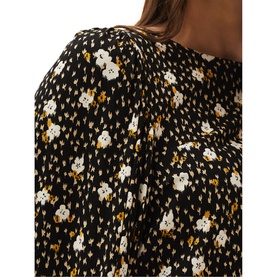 Model wearing Phase 8 Daizy Ditsy Print Jersey Top in multi, black with white and gold floral print, blouson long sleeve with cuffs visible