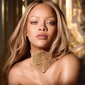 Model with Dior J'adore Hair Mist 40ml, wearing a layered gold pearl choker necklace against an ornate gold backdrop