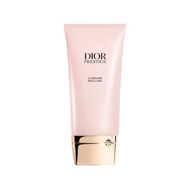 Dior Prestige La Mousse Micellaire Face Cleanser in a pink tube with gold cap and embossed snowflake detail