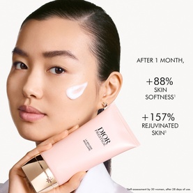 Model with Dior Prestige La Mousse Micellaire Face Cleanser applied to cheek, showing skin softness and rejuvenation claims after 1 month