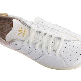 Adidas Earlham Trainers in white leather with perforated detailing, gold logo, cream insole and off-white cupsole
