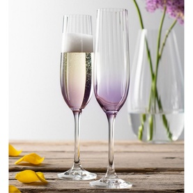 Galway Crystal Erne Flute Set of Two in Amethyst, clear-to-purple ombr&eacute; champagne flutes with ribbed detailing, styled on wooden surface