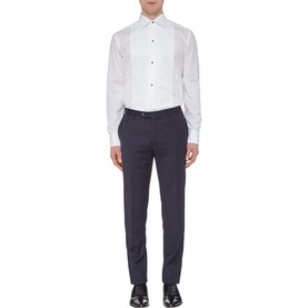 Model wearing Eton Bib Front Evening Shirt in white with black stud buttons, styled with navy trousers and black Oxford shoes