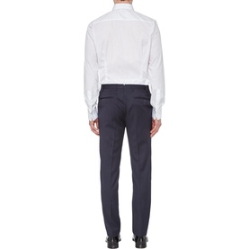 Model wearing Eton Bib Front Evening Shirt in white, styled with navy tailored trousers. Rear view