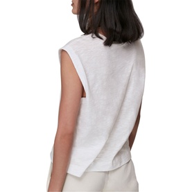 Model wearing Whistles Easy Muscle Vest Top in white cotton, shown from behind with open back detail, styled with cream wide-leg trousers