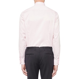 Model wearing Eton Slim Double Twill Shirt in pink, single cuff, rear view, styled with dark charcoal trousers