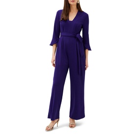 Model wearing Phase Eight Eydie Fluted Sleeve Jumpsuit in blue, V-neck, 3/4 fluted sleeves, wide-leg trousers, tie belt waist