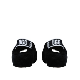 UGG Australia Fab Yeah Shearling Slides in black, rear view showing branded elastic strap with white UGG logo and shearling footbed