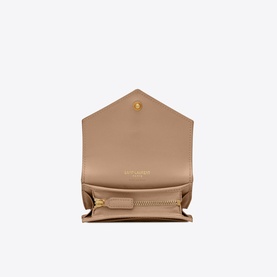 Saint Laurent Monogram Quilted Leather Flap Wallet in beige, open view showing gold zip compartment and interior layout