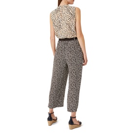 Model wearing Hobbs Flora Top in white leopard print, styled with matching wide-leg trousers and tan wedge sandals, rear view