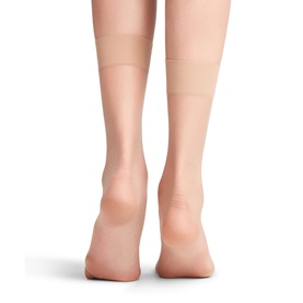 Model wearing Falke Shelina Anklet Socks in Powder, ultra-sheer tan anklet style with non-reinforced toes, rear view