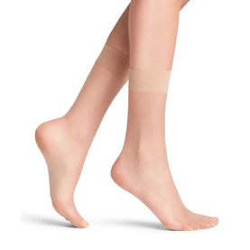 Model wearing Falke Shelina Anklet Socks in Powder, ultra-sheer nude ankle socks with wide comfort band and non-reinforced toes