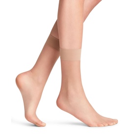 Model wearing Falke Shelina Anklet Socks in Brazil brown, ultra-sheer with a sensitive cuff, shown on bare feet and ankles