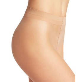 Model wearing Falke Shelina Tights in Powder skin tone, 12 denier ultra-sheer finish, high-waist cut with sandal toe