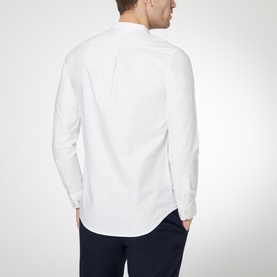 Model wearing Farah Vintage Brewer Grandad Shirt in white, back view, styled with navy trousers