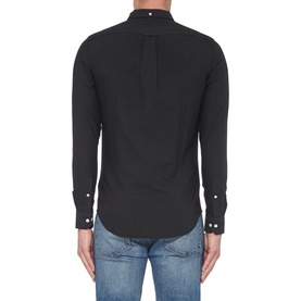 Model wearing Farah Vintage Brewer Slim Fit Shirt in black, rear view, with silver button cuffs, styled with blue jeans