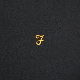 Farah Vintage Brewer Slim Fit Shirt in black, close-up of gold embroidered F logo on chest fabric