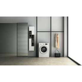 Whirlpool FreshCare 8kg 1400 Spin 6th Sense Clean white washing machine shown in a styled laundry room setting