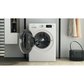Whirlpool FreshCare 8kg 1400 Spin 6th Sense Clean white washing machine with door open, shown in a modern laundry room setting