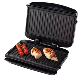 Russell Hobbs Large 5 Portion Health Grill in black, open with grilled chicken fillets and cherry tomatoes on the ridged plate