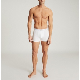 Model wearing Reiss Heller Three-Pack Organic Cotton Boxers in white, shown in a full-length front-facing pose