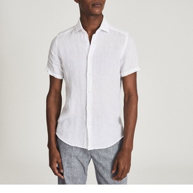 Model wearing Reiss Holiday Linen Slim Fit Shirt in white, short-sleeve, styled with grey marl trousers