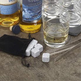 HOMIU Whisky Stones Gift Set of Nine, grey granite ice cubes with black velvet pouch, tongs, glasses and whisky bottles styled in background