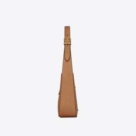 Saint Laurent Le 5 &Agrave; 7 Leather Hobo Bag in brown vegetable-tanned calfskin, side profile view, bronze-tone hardware and adjustable strap