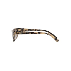 Miu Miu Cat Eye Sunglasses 0MU 10US in brown tortoiseshell with gold-tone hardware, shown from the side