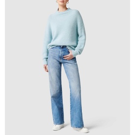 Model wearing Forever New Hester Rib Knit Sweater in blue with stand neck and deep cuffs, styled with light wash wide-leg jeans