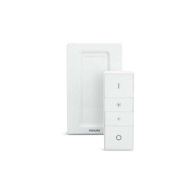 Philips Hue Dimmer Switch in white, shown with wall mount bracket and handheld remote control unit