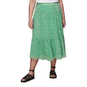 Model wearing Whistles Indo Floral Wrap Skirt in green floral print, midi length with tiered hem, styled with black strappy sandals