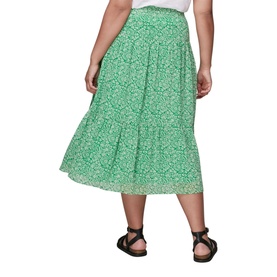Model wearing Whistles Indo Floral Wrap Skirt in green floral print, midi length with tiered hem, styled with black sandals