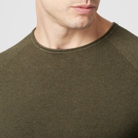 Model wearing Jack & Jones Textured Crew Sweater in khaki, close-up showing crew neckline and raglan sleeve detail