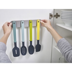 Joseph Joseph Doorstore Utensils 4 Piece Set in grey, wall-mounted inside cabinet door, showing four colourful silicone utensils on magnetic strip
