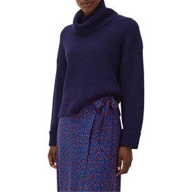 Model wearing Phase Eight Karine Chunky Roll Neck Sweater in blue ribbed knit, styled with a floral midi skirt