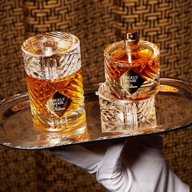 KILIAN PARIS Angels' Share Eau de Parfum Refillable 100ml, amber-toned crystal flacon and matching glass on silver tray