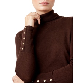 Model wearing Hobbs Lara Roll Neck in brown, close-up detail of roll neck and cuffs with gold button trim