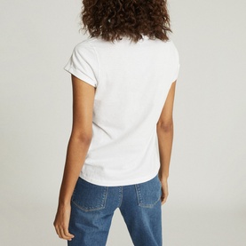 Model wearing Reiss Luana V-Neck T-Shirt in white, back view, styled with blue denim jeans