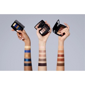 Lanc&ocirc;me Hypn&ocirc;se Drama Eyeshadow Palette trio shown open on raised arms with swatched shades in blue, nude and warm brown tones