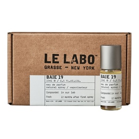 Le Labo BAIE 19 Eau de Parfum rollerball bottle beside branded kraft box, 15ml travel-size format