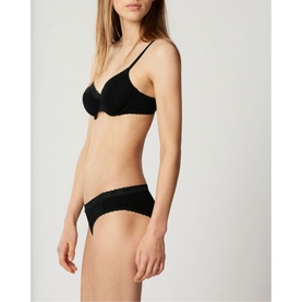 Model wearing Lejaby La Petite Brief in black with matching black bra, featuring delicate lace trim detail