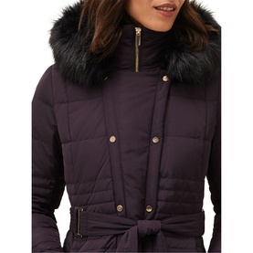 Model wearing Phase Eight Leonor Tie Belt Midi Puffer Coat in purple, showing faux fur collar, gold hardware, and fabric tie belt detail