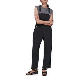 Model wearing Whistles Leni Dungarees in black, wide-leg fit with adjustable straps, styled with grey vest and black sandals