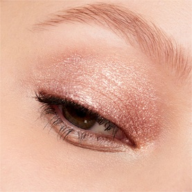 MAC Dazzleshadow Liquid in Every Day Is Sunshine, a shimmering rose gold liquid eyeshadow shown applied to eyelid