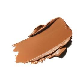 MAC Studio Fix Tech Cream-To-Powder Foundation swatch in warm tan-brown shade, smooth creamy texture spread across white background