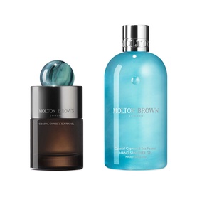 Molton Brown Coastal Cypress & Sea Fennel fragrance and hand wash set, dark glass bottle with teal stopper and blue pump bottle