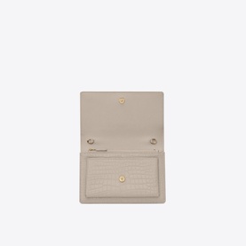 Saint Laurent Sunset Croc-Embossed Shiny Leather Chain Wallet in white, open view showing interior card slots and gold press-stud closure