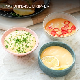 Kenwood Mini Chopper lifestyle shot showing three ceramic bowls of freshly made dips garnished with herbs, chilli and lemon slices