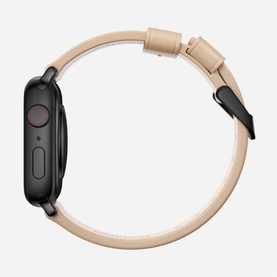 Nomad Modern Slim Strap 40mm/38mm in beige leather with black buckle, shown fitted on a black smartwatch, side view